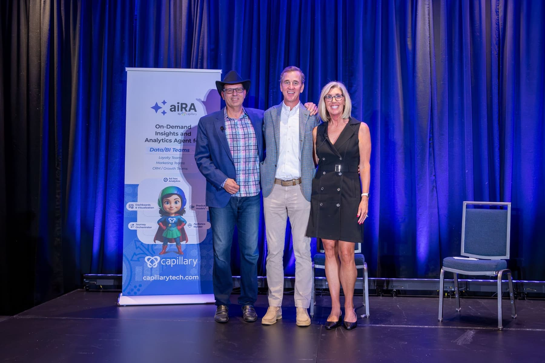Keynote speaker Cooper Manning on the Captivate stage with two hosts