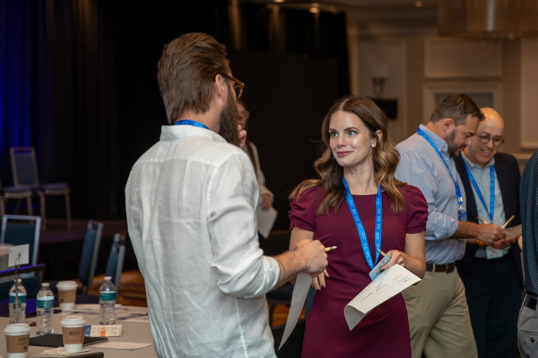 A Captivate attendee smiling mid-conversation between sessions