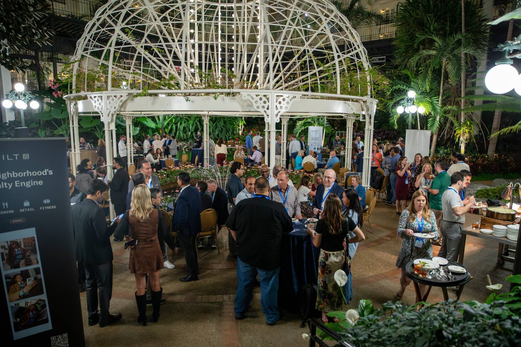 Captivate guests at the evening reception under a lit gazebo in the Gaylord Opryland atrium